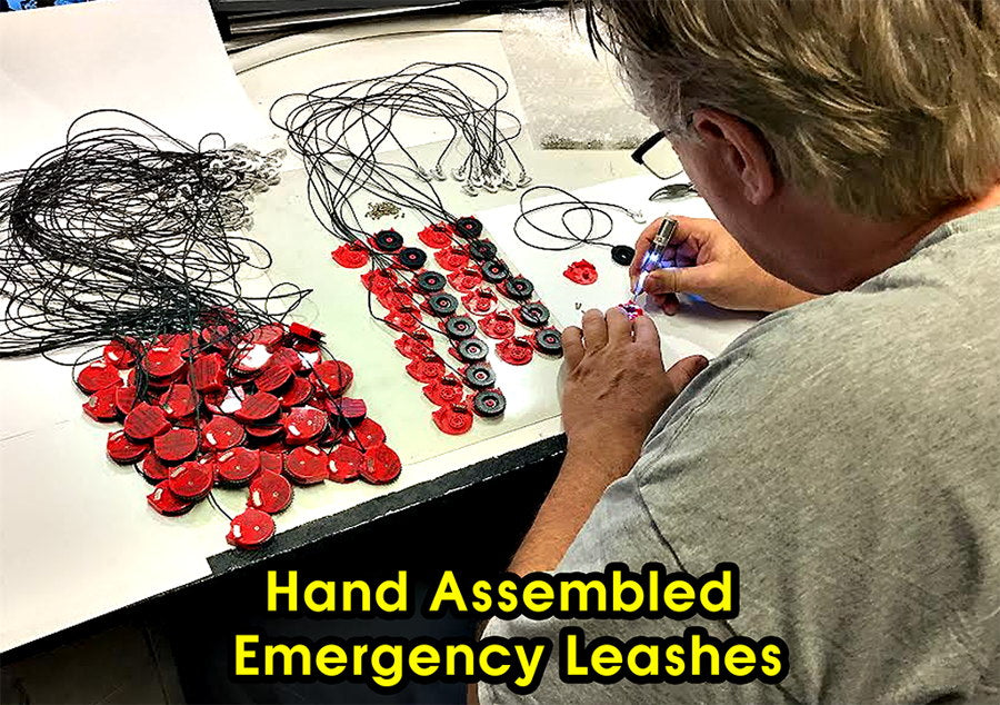 Emergency Leash inventor John Harris hand assembling red leash bodies at a workbench